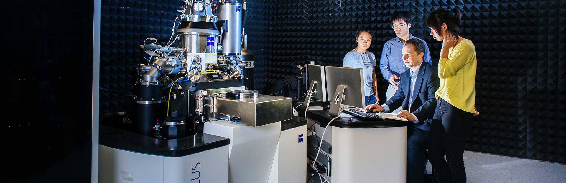 students and professor in the lab